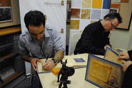 Norm and I busily signing (all photos courtesy Fremantle Press)