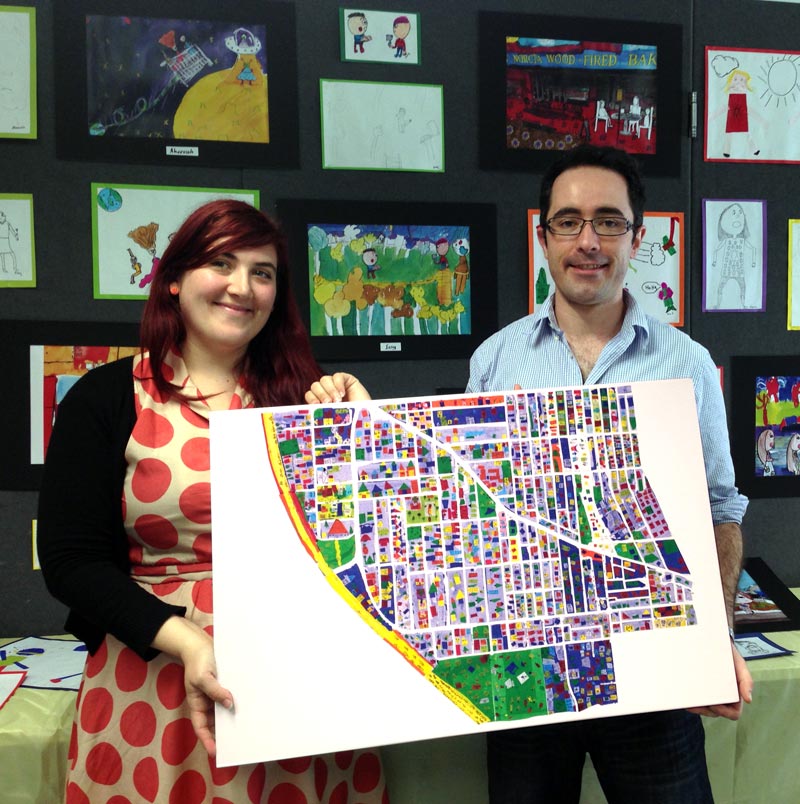 Briony and James with student artwork