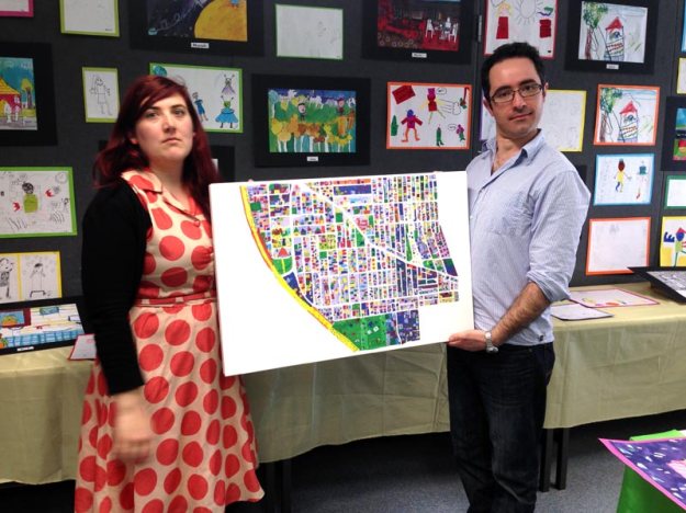 Briony and James with student artwork